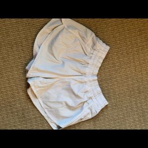 White lululemon tracker shorts.